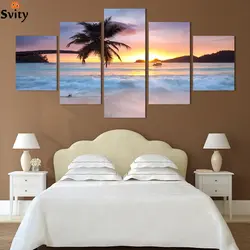 What kind of paintings are hung in the bedroom above the bed photo