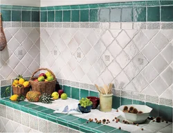 Laying tiles on a kitchen backsplash photo