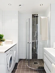 Small Bathroom With Shower And Washing Machine Photo