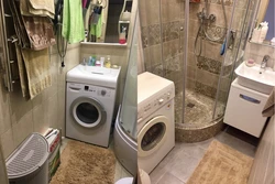 Small bathroom with shower and washing machine photo