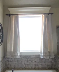 Curtains in the bathroom on the window photo