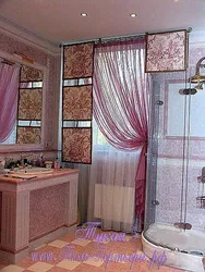 Curtains in the bathroom on the window photo