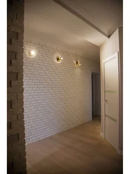 Plaster bricks on the wall in the hallway interior