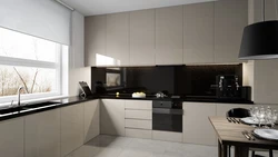 Beige kitchen design with black countertop