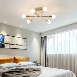 Photo of a ceiling with spotlights and a chandelier in the bedroom
