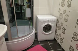 Interior of small bathrooms with shower and washing machine