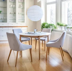 White chairs and table in the kitchen interior