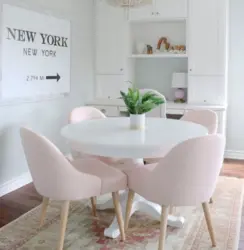 White chairs and table in the kitchen interior