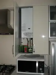 Cabinet for a gas boiler in the kitchen photo