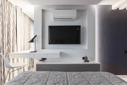 Wall design in the bedroom opposite the bed with TV