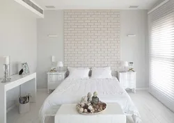 Bedroom with brick wall design photo