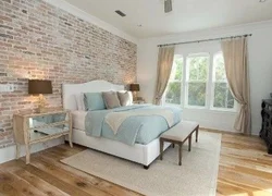 Bedroom with brick wall design photo