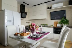 Corner kitchens with TV on the wall photo