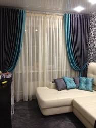 Turquoise color of curtains in the living room interior photo