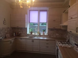 Corner kitchen design with window in apartment
