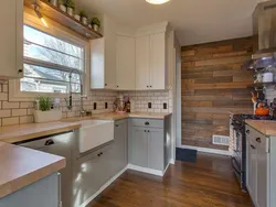 Kitchen with wooden countertop in beige interior