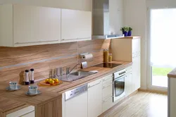 Kitchen with wooden countertop in beige interior