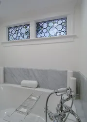 Khrushchev kitchen design with a window to the bathroom