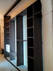 Cabinets in a narrow hallway in the corridor photo