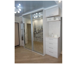 Built-in wardrobe in the hallway in light colors photo