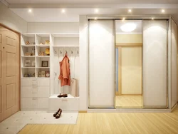 Built-in wardrobe in the hallway in light colors photo