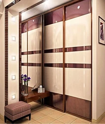 Built-In Wardrobe In The Hallway In Light Colors Photo