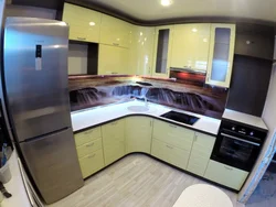 Corner kitchen design photo in modern style
