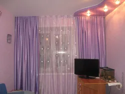 Suspended ceiling in the apartment photo curtains in the living room