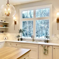 Kitchen interior with a large window in the house