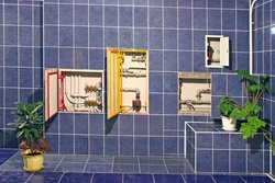 Photo of pipes on the bathroom wall