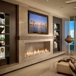 Photo of a fireplace in an apartment with a TV in a modern style