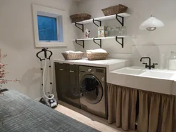 Photo Of A Bathroom Countertop Under The Sink And Washing Machine