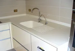 Countertop made of artificial stone for the kitchen photo with sink