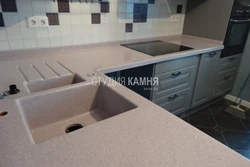 Countertop made of artificial stone for the kitchen photo with sink