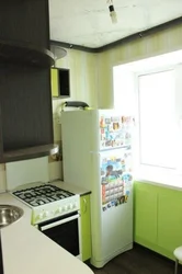 Small kitchen design with refrigerator and gas