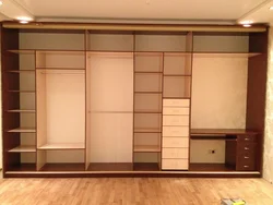Photo of a wardrobe in the living room that covers the entire wall