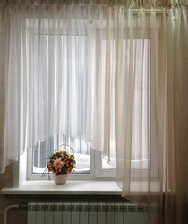 Curtains in the kitchen on a large window photo