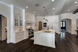 Interior white kitchen dark floor