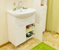 Washbasin In The Bathroom With Cabinet Photo