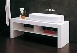 Washbasin in the bathroom with cabinet photo