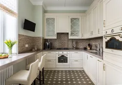 White kitchen design with dark countertops