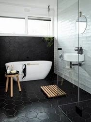Bath Design With Dark Tiles On The Floor