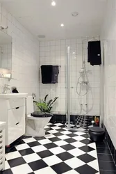 Bath design with dark tiles on the floor