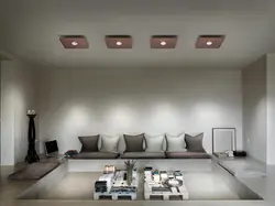 Suspended ceiling with spotlights and chandelier in the living room photo