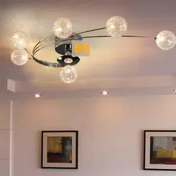 Suspended Ceiling With Spotlights And Chandelier In The Living Room Photo