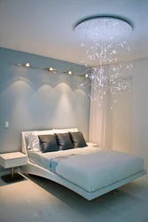 Suspended ceiling with light bulbs without a chandelier in the bedroom photo