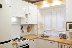 Kitchen design 5m2 with a refrigerator with a column in Khrushchev