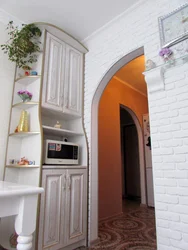 Arch in the door of a small kitchen photo