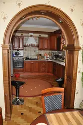 Arch in the door of a small kitchen photo