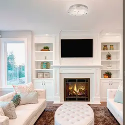 Living room design with electric fireplace and TV photo